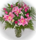 Send pink lilies and roses in a glass vase - click to enlarge