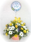 Flower arrangement in yellow and white with a stick balloon - click to enlarge