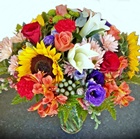 Deliver a mixture of quality seasonal fresh cut flowers in a glass vase - Click to enlarge