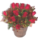 Send Red roses and berries in a matching container - click to enlarge