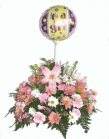 Send a flower arrangement in shades of pink with a stick balloon - click to enlarge