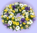 Send a ring-shaped wreath of quality flowers - click to enlarge