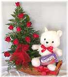 Send an arrangement of 12 or 20 red roses with a small teddy and a box of chocs - Click to enlarge